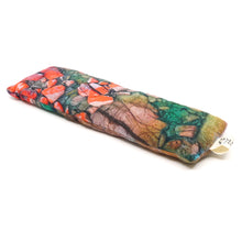 Load image into Gallery viewer, Printed fabric with orange rocks and greenery.
