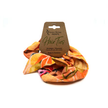 Load image into Gallery viewer, Orange patterned cotton hair tie.
