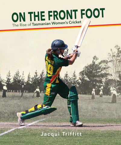 Female cricketer in uniform striking ball with cricket bat.