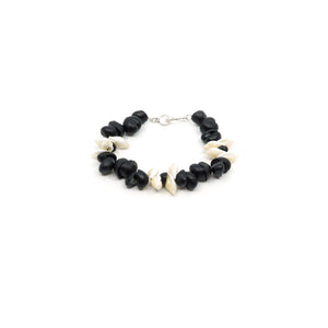Black and white shell bracelet with silver clasp.