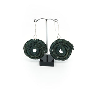 Dark green woven spiral earrings with silver hooks.