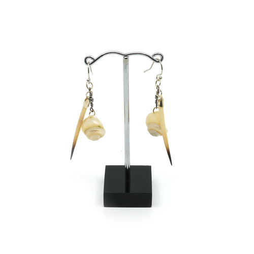 White button and echidna quills on silver drop earrings.