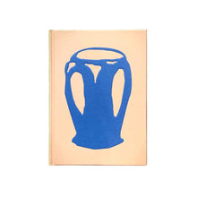 Load image into Gallery viewer, Beige book with blue abstract jug image.
