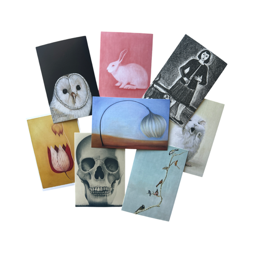 Collection of eight postcards with various designs on a white background