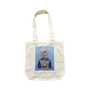 White tote bag with a man and sea life.