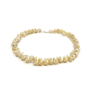 Maireener and white button shell necklace with a silver parrot clasp.