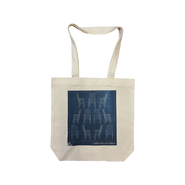 Calico tote bag with a blueprint image of a chair. 
