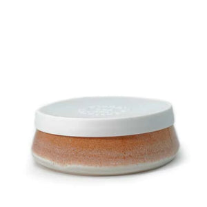 Earthy orange tones ceramic bowl with a white silicone lid.