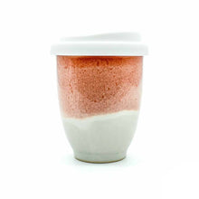 Load image into Gallery viewer, Light orange and cream with a white silicone lid ceramic cup.

