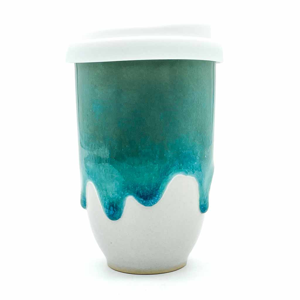 Aqua and white ceramic cup with white lid.