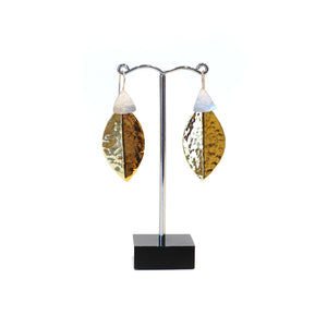 Stylised leaf shape in hammered brass and silver.