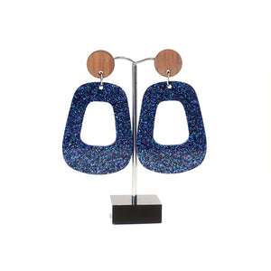 Blue sparkly retro hoops with wooden disc studs.