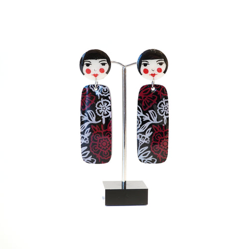 Black and red flower design acrylic dangle earrings.