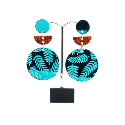 Teal  and orange circle and half moon acrylic statement earrings.