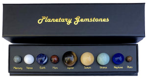 Photo of box assorted gemstones representing planets.