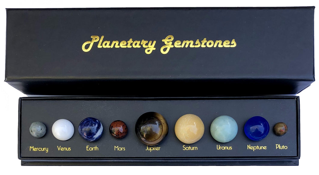 Photo of box assorted gemstones representing planets.