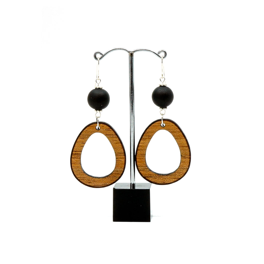 Wooden teardrop earring with black glass bead on dangle hooks.