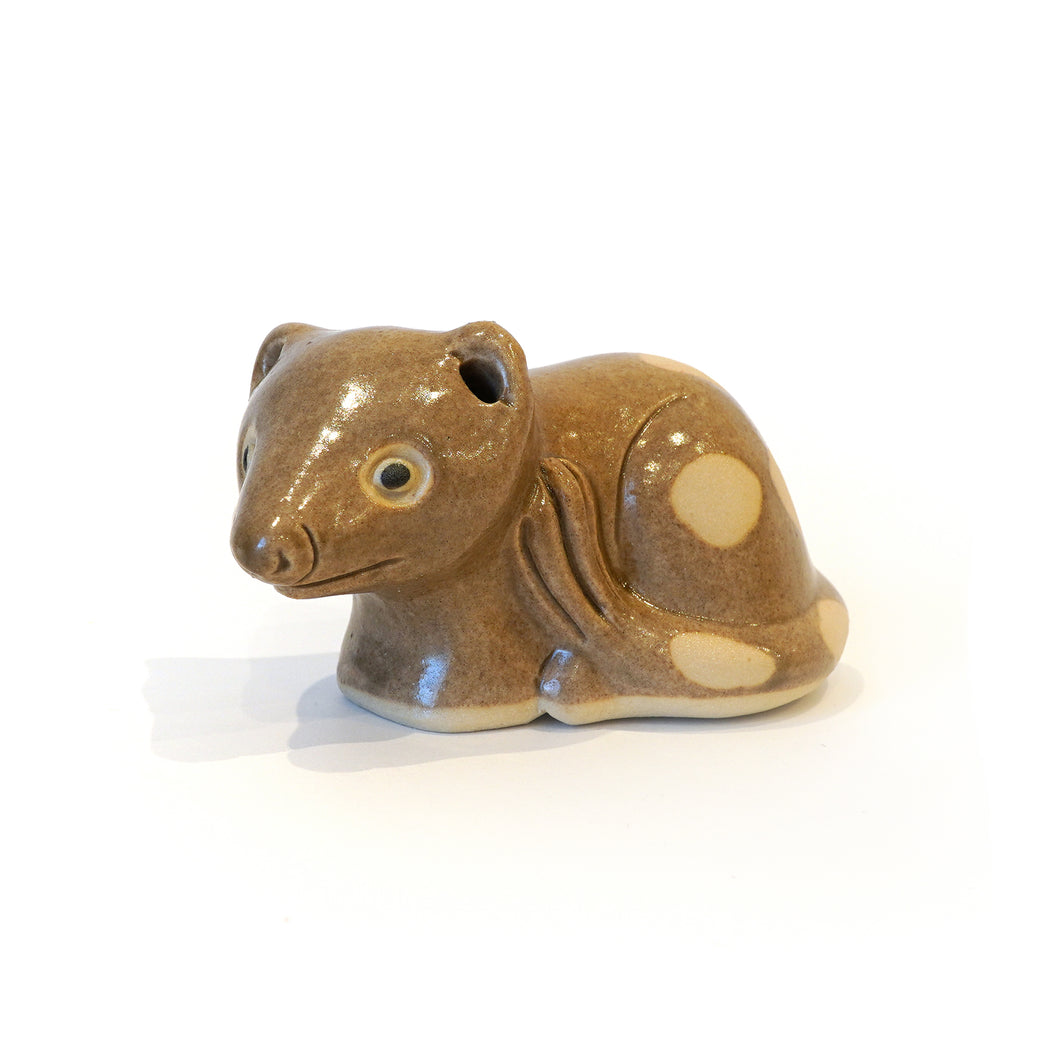 Stylised ceramic spotted quoll collectible ornament.